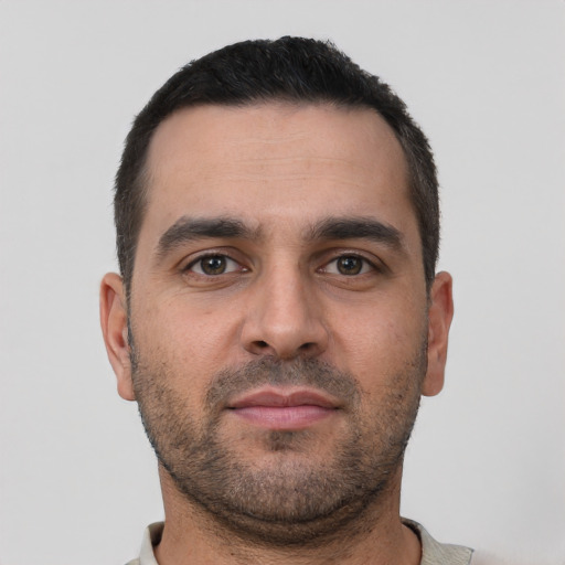Neutral white young-adult male with short  black hair and brown eyes