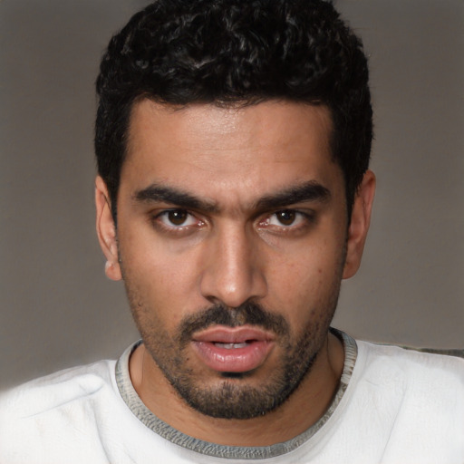 Neutral white young-adult male with short  black hair and brown eyes