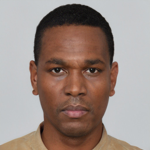 Neutral black young-adult male with short  black hair and brown eyes