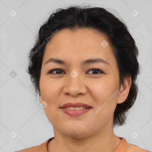 Joyful asian adult female with medium  brown hair and brown eyes