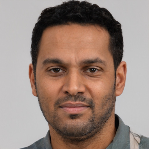 Neutral latino adult male with short  black hair and brown eyes