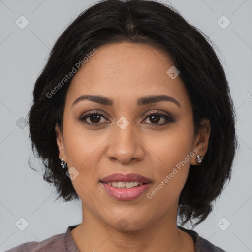 Joyful latino young-adult female with medium  brown hair and brown eyes