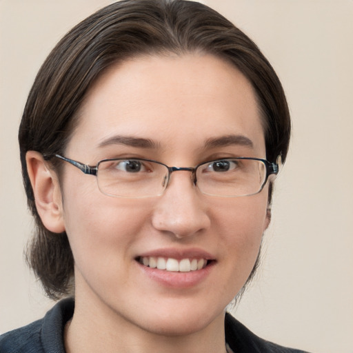 Joyful white young-adult female with medium  brown hair and brown eyes