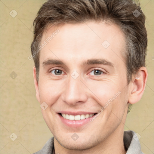 Joyful white adult male with short  brown hair and grey eyes