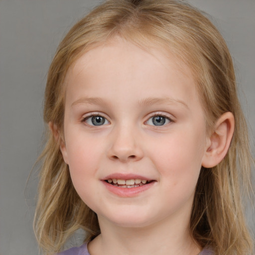 Joyful white child female with medium  brown hair and blue eyes