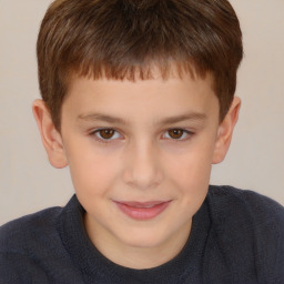 Joyful white child male with short  brown hair and brown eyes