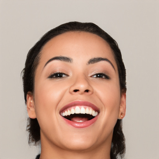 Joyful white young-adult female with medium  black hair and brown eyes