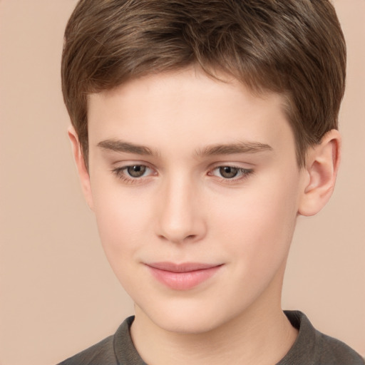 Joyful white child male with short  brown hair and brown eyes