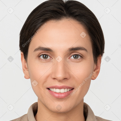 Joyful white young-adult female with short  brown hair and brown eyes