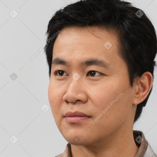 Neutral asian young-adult male with short  black hair and brown eyes