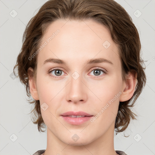 Joyful white young-adult female with medium  brown hair and green eyes