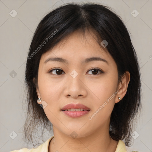 Joyful asian young-adult female with medium  brown hair and brown eyes