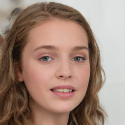 Joyful white young-adult female with long  brown hair and blue eyes