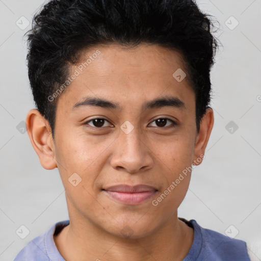 Joyful latino young-adult male with short  brown hair and brown eyes