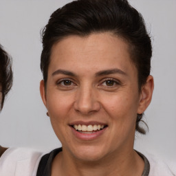 Joyful white adult female with short  brown hair and brown eyes