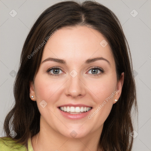 Joyful white young-adult female with medium  brown hair and green eyes