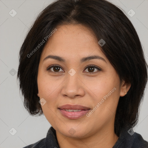 Joyful asian adult female with medium  brown hair and brown eyes