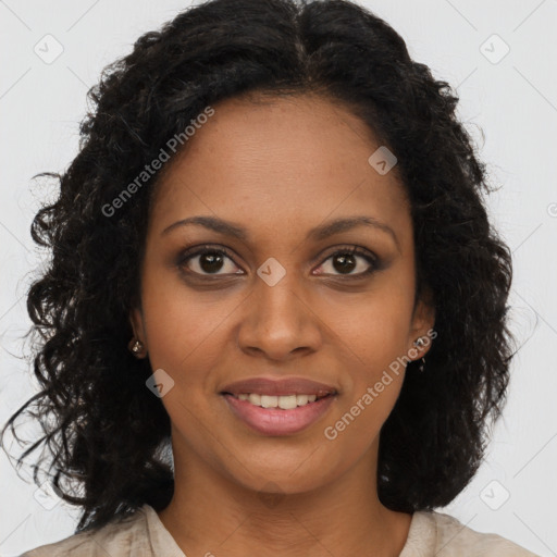 Joyful black young-adult female with long  brown hair and brown eyes