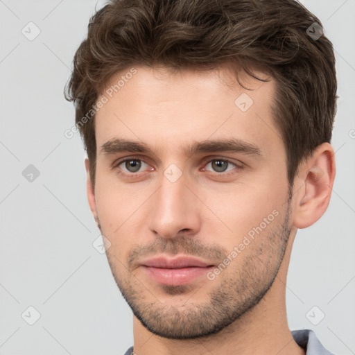 Neutral white young-adult male with short  brown hair and brown eyes