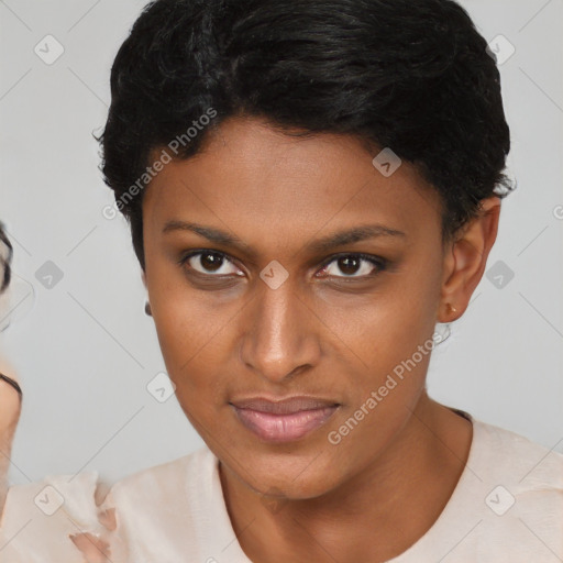 Joyful black young-adult female with short  brown hair and brown eyes