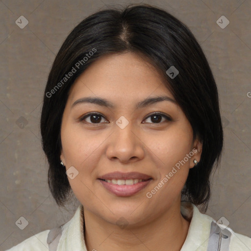 Joyful latino young-adult female with medium  brown hair and brown eyes