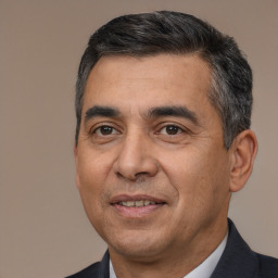 Joyful white adult male with short  black hair and brown eyes