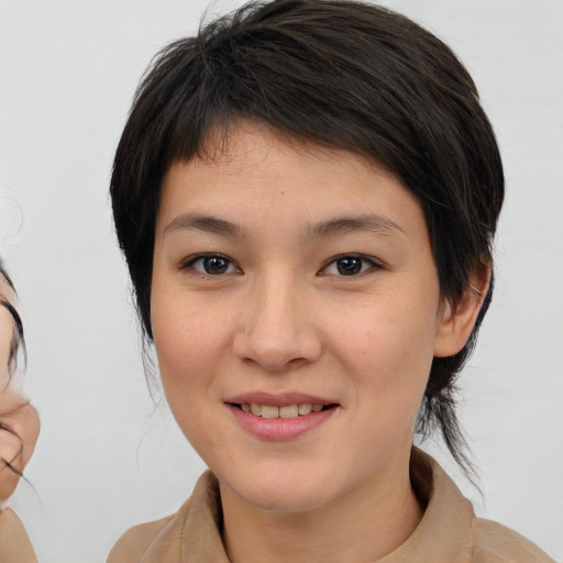 Joyful white young-adult female with medium  brown hair and brown eyes