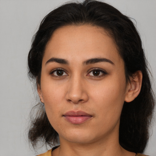Neutral latino young-adult female with long  brown hair and brown eyes