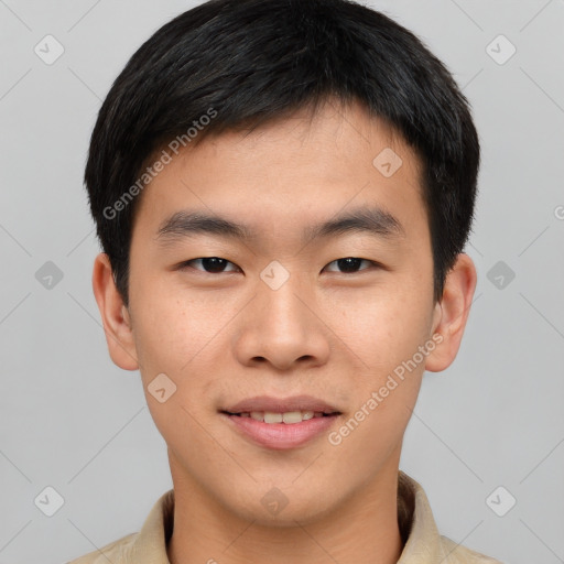 Joyful asian young-adult male with short  brown hair and brown eyes