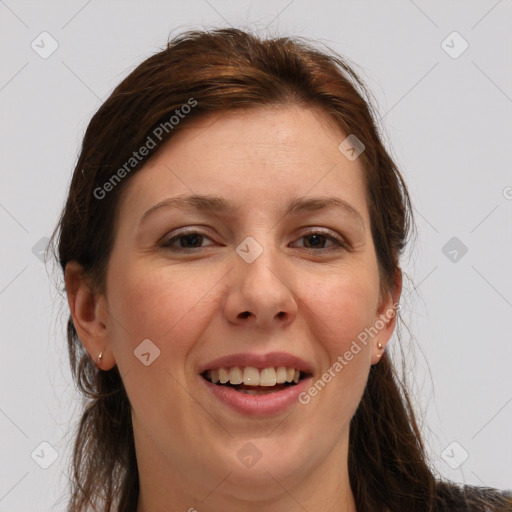 Joyful white young-adult female with long  brown hair and grey eyes