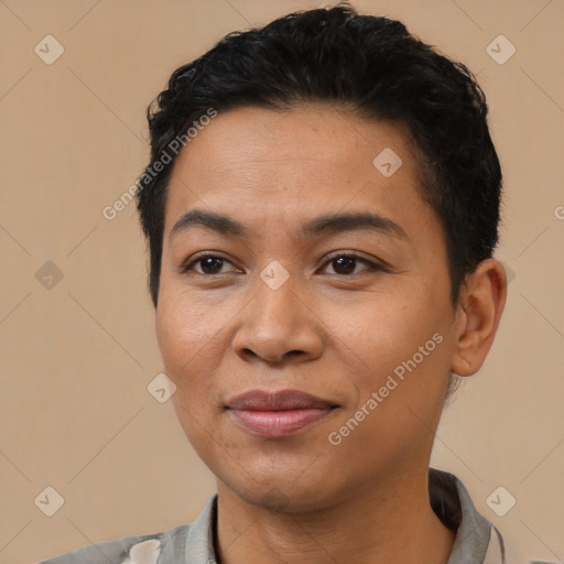 Joyful latino young-adult female with short  black hair and brown eyes