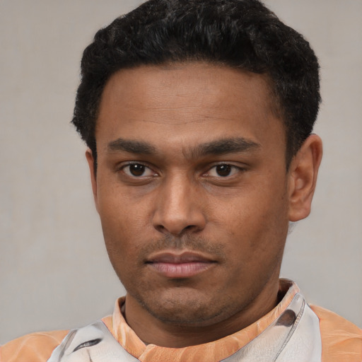 Neutral latino young-adult male with short  black hair and brown eyes