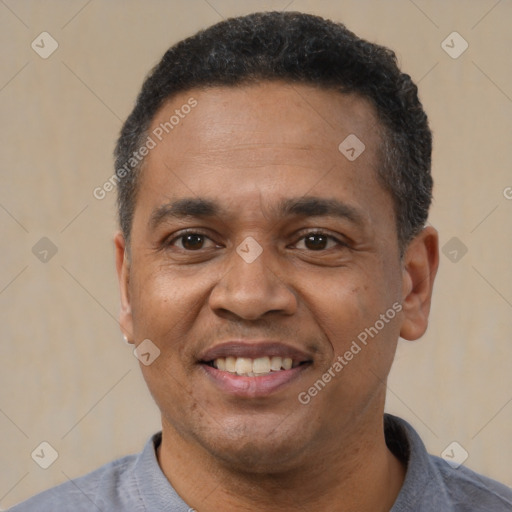 Joyful latino adult male with short  black hair and brown eyes