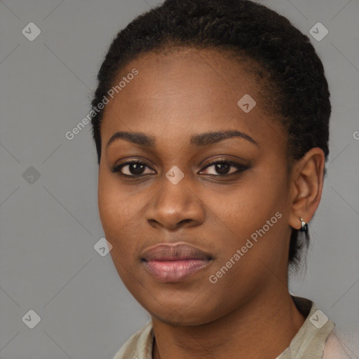 Joyful black young-adult female with long  brown hair and brown eyes