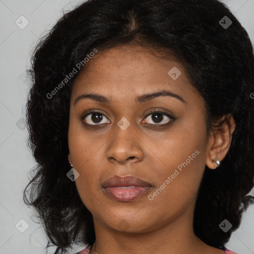 Joyful black young-adult female with medium  brown hair and brown eyes