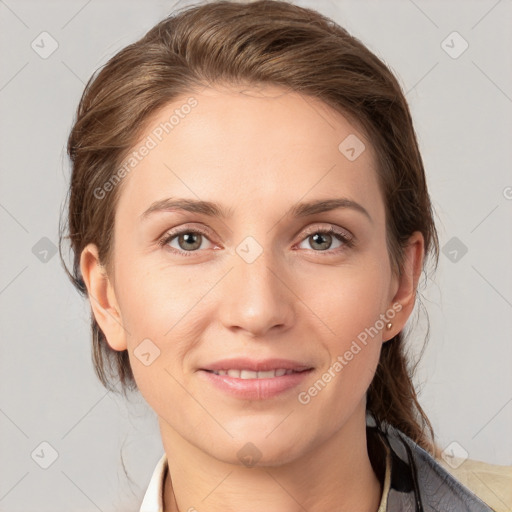 Joyful white young-adult female with medium  brown hair and grey eyes