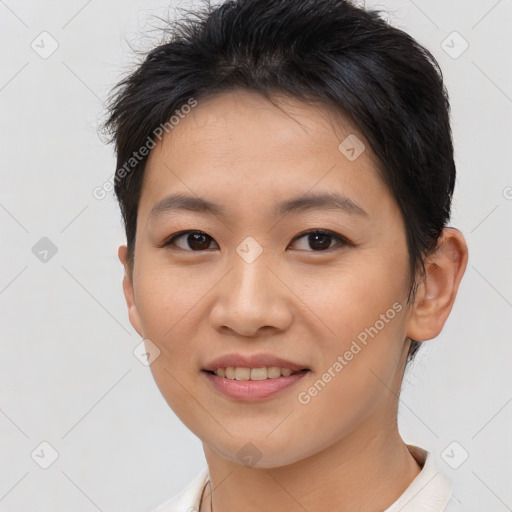 Joyful asian young-adult female with short  brown hair and brown eyes