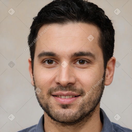 Joyful white young-adult male with short  black hair and brown eyes