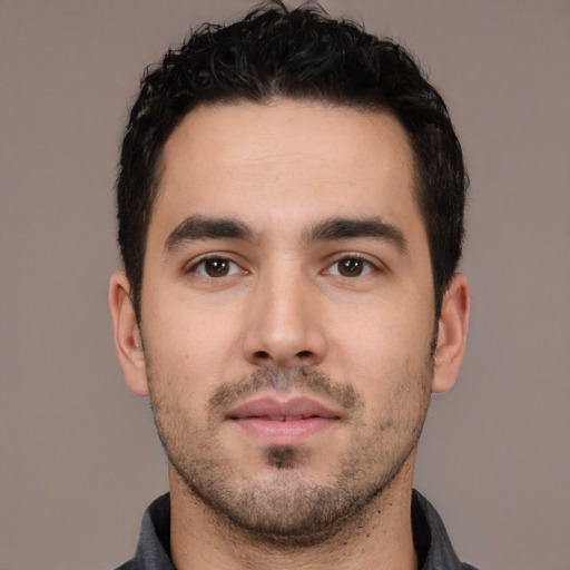Neutral white young-adult male with short  black hair and brown eyes