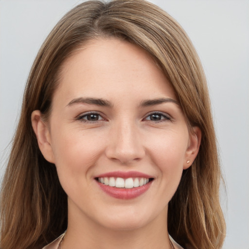 Joyful white young-adult female with long  brown hair and grey eyes