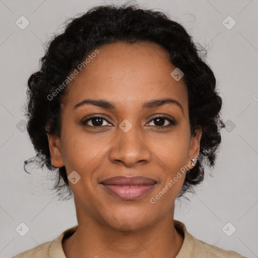 Joyful black adult female with medium  brown hair and brown eyes