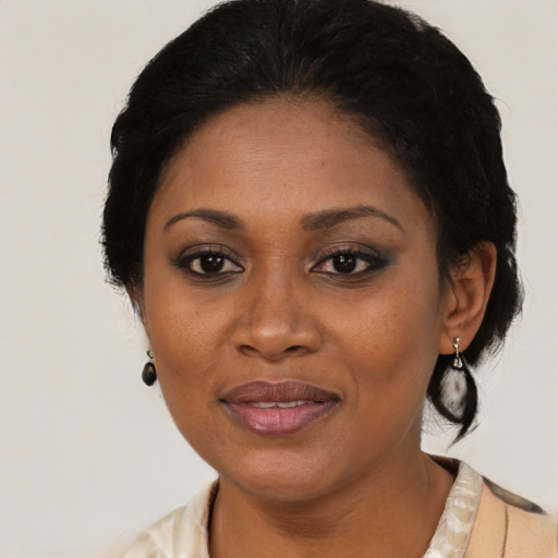 Joyful black adult female with medium  black hair and brown eyes