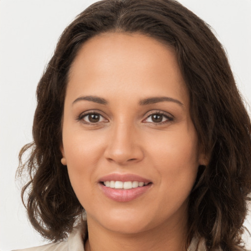 Joyful white young-adult female with long  brown hair and brown eyes