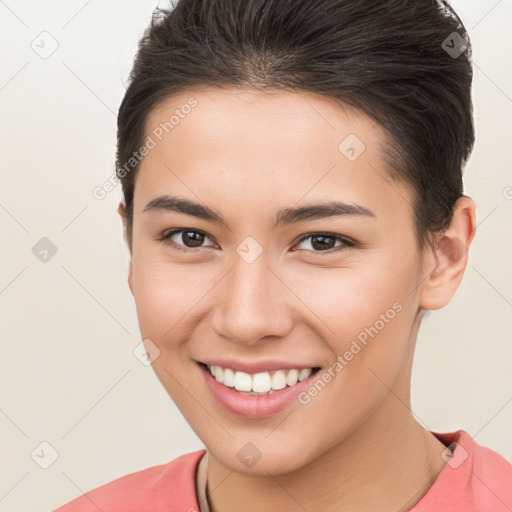 Joyful white young-adult female with short  brown hair and brown eyes