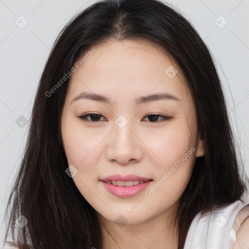 Joyful asian young-adult female with long  brown hair and brown eyes