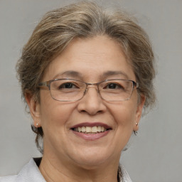 Joyful white middle-aged female with short  brown hair and brown eyes