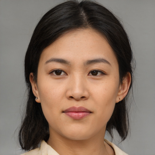 Neutral asian young-adult female with medium  brown hair and brown eyes