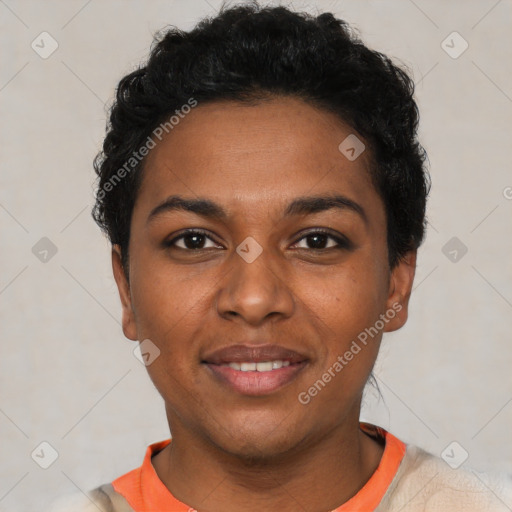 Joyful black young-adult female with short  black hair and brown eyes