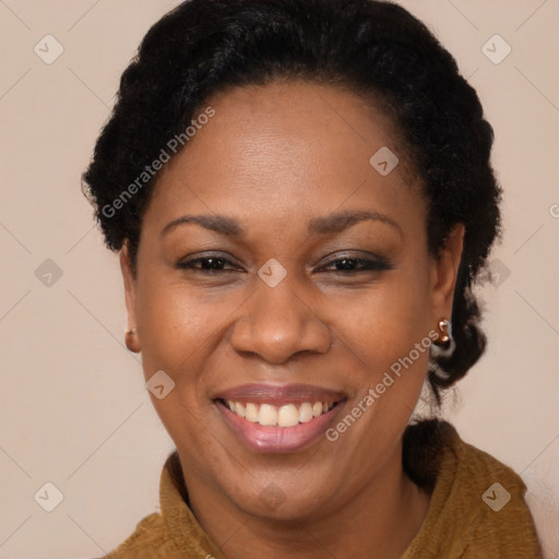 Joyful black adult female with short  brown hair and brown eyes