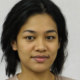 Joyful asian young-adult female with medium  black hair and brown eyes